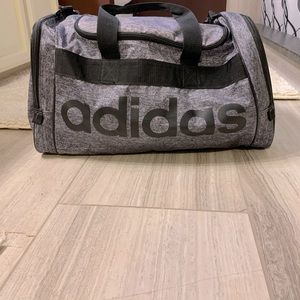 Dark gray and black adidas duffel gym bag
